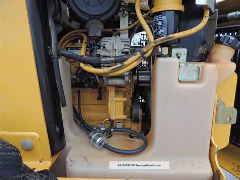 john deere 320 skid steer where to put hydraulic fluid|john deere 320 skid steer.